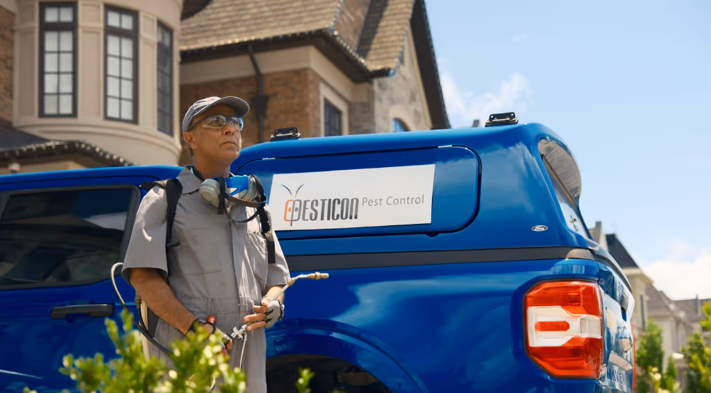 Pesticon technician with service truck – Pest Control Coquitlam