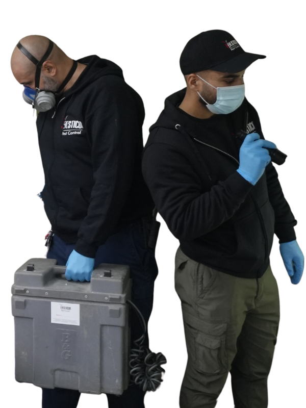 Two licensed Pesticon pest control technicians in protective equipment carrying treatment cases to a Langley job