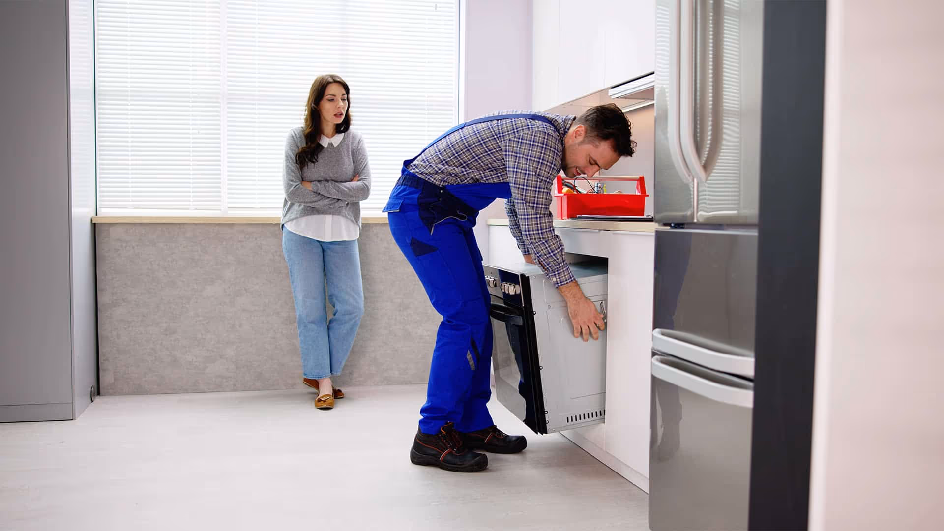 Pesticon technician inspecting a rented Surrey kitchen with the tenant present